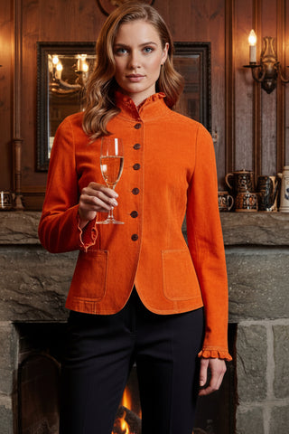 Orange Leather jacket on a mannequin with boots in the background
