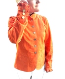 Peach-colored jacket with button details on a white background